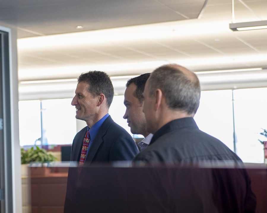 Professionals in conversation at a meeting